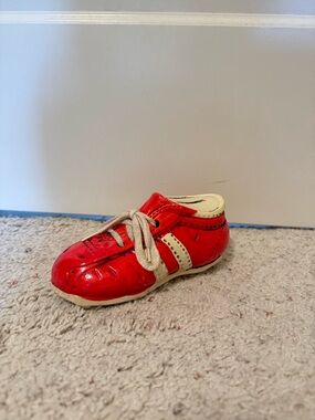 Vintage ceramic sneaker or cleat-shaped coin bank